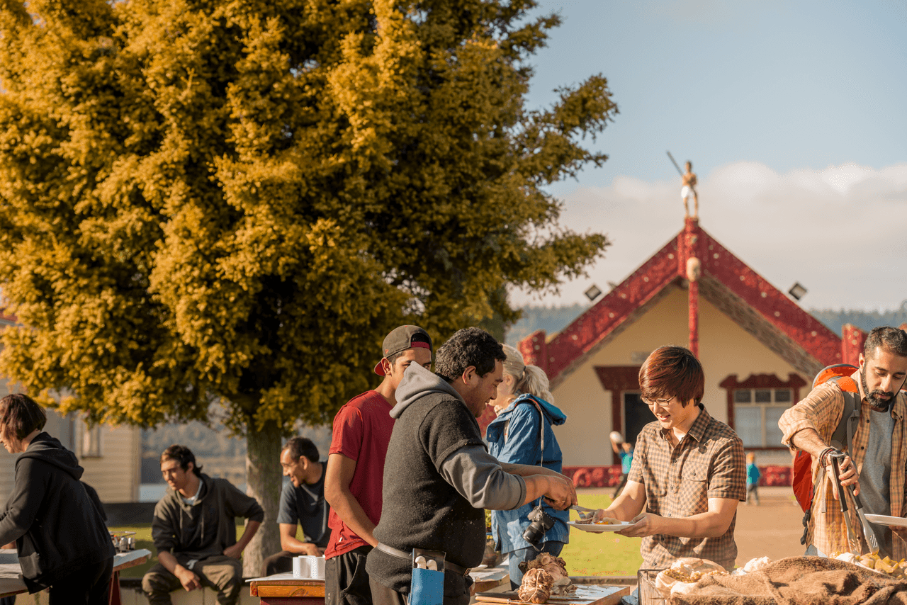 International students being offered food at Marae